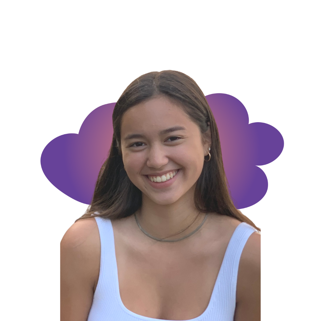 riley A smiling woman in a gray beanie hugging a black and white dog wearing a purple harness.