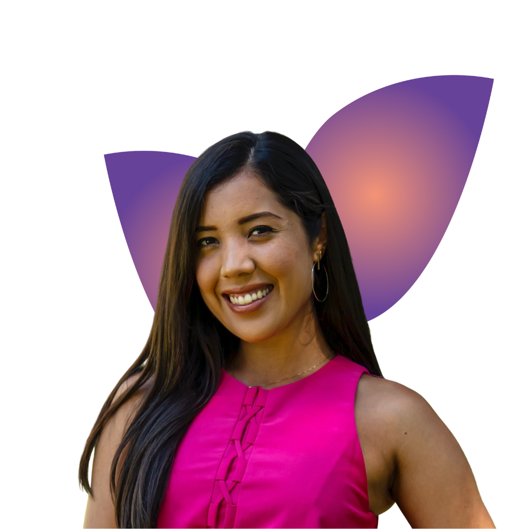 riley A smiling woman in a gray beanie hugging a black and white dog wearing a purple harness.