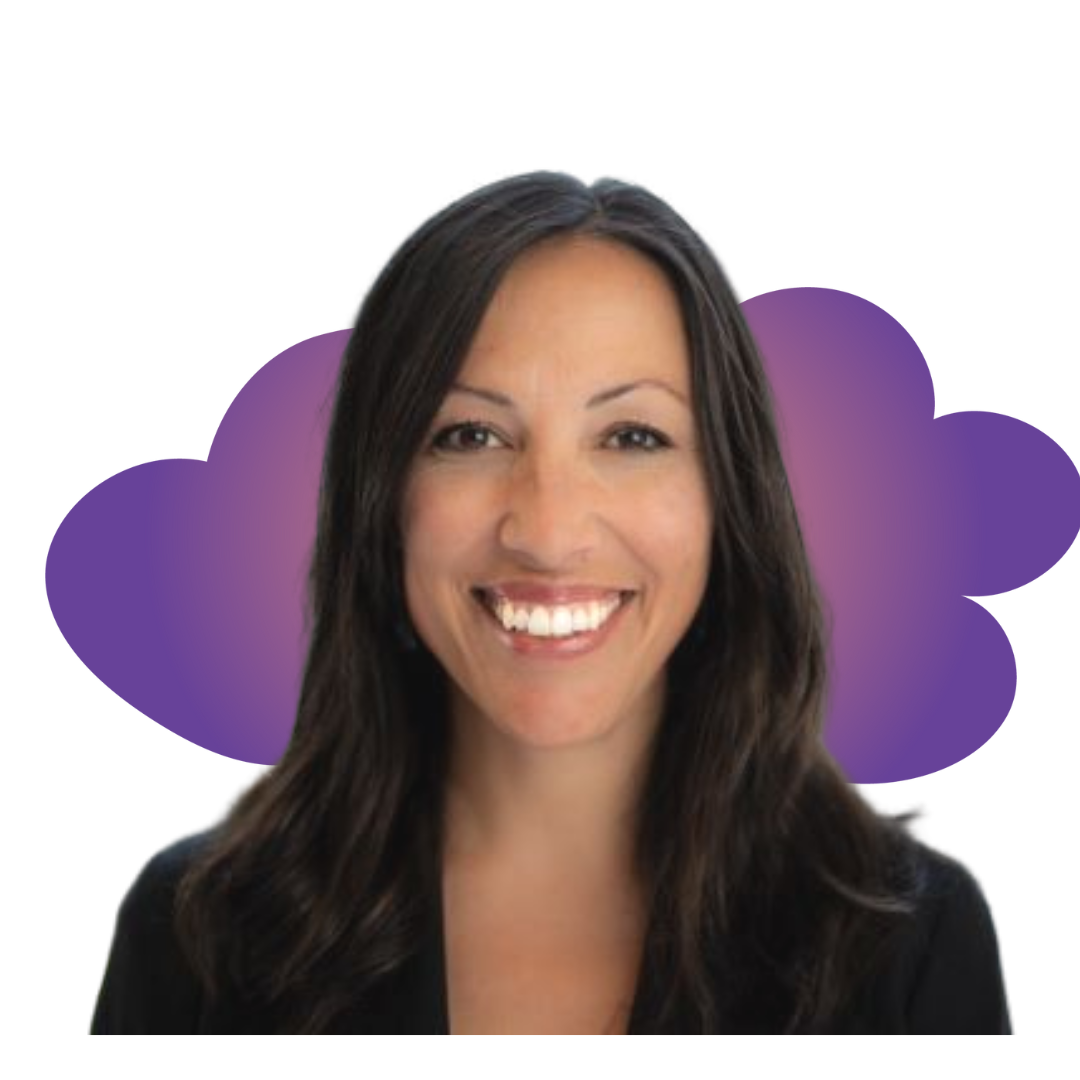 riley A smiling woman in a gray beanie hugging a black and white dog wearing a purple harness.